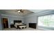 Comfortable main bedroom with tray ceilings, crown molding and natural light at 2698 Bonar Hall Path, Duluth, GA 30097