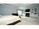 Main bedroom with tray ceiling, fireplace and built-in shelving at 2698 Bonar Hall Path, Duluth, GA 30097