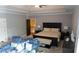 Spacious bedroom with tray ceilings, a ceiling fan, sitting area, and plush carpeting for a luxurious feel at 2698 Bonar Hall Path, Duluth, GA 30097