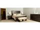 Beautifully furnished main bedroom with a dark wood bed frame and matching furniture at 2698 Bonar Hall Path, Duluth, GA 30097