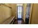 Practical mudroom with built-in seating, coat hooks, and a convenient access door to the outside at 2698 Bonar Hall Path, Duluth, GA 30097