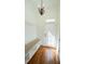 Bright mudroom featuring hardwood floors, built-in bench with storage, and access to the outside at 2698 Bonar Hall Path, Duluth, GA 30097