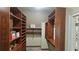 Spacious walk-in closet features custom shelving, drawers, and ample storage space for an organized wardrobe at 2698 Bonar Hall Path, Duluth, GA 30097