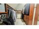 Well-organized walk-in closet featuring custom shelving, drawers, and hanging space for clothing and accessories at 2698 Bonar Hall Path, Duluth, GA 30097