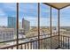 Breathtaking city view from condo balcony with tall buildings, including the Bank of America building, and a clear blue sky at 300 Peachtree Ne St # 19B, Atlanta, GA 30308