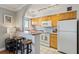Efficient kitchen featuring stainless steel appliances, breakfast bar, tile floors and track lighting at 300 Peachtree Ne St # 19B, Atlanta, GA 30308