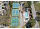 Overhead view of community amenities featuring tennis courts and a swimming pool area at 1673 Chadwick Ridge Dr, Lawrenceville, GA 30043