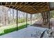 The back patio features an exposed beam ceiling and outdoor seating area at 1673 Chadwick Ridge Dr, Lawrenceville, GA 30043