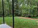 Mature trees provide a private, park-like setting in the lush backyard at 1673 Chadwick Ridge Dr, Lawrenceville, GA 30043
