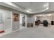 Spacious basement with gray carpet opens to a recreation room, utility area, and walkout entrance at 1673 Chadwick Ridge Dr, Lawrenceville, GA 30043