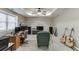 Finished basement area with guitar and media set up, ceiling fan and recessed lighting at 1673 Chadwick Ridge Dr, Lawrenceville, GA 30043