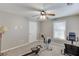 Bedroom featuring neutral walls, carpet floor, a ceiling fan, and space for exercising at 1673 Chadwick Ridge Dr, Lawrenceville, GA 30043