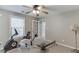 Bedroom featuring neutral walls, carpet floor, a ceiling fan, and space for exercising at 1673 Chadwick Ridge Dr, Lawrenceville, GA 30043