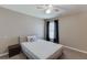 Inviting bedroom with a comfortable bed, carpet flooring, and black-out curtains at 1673 Chadwick Ridge Dr, Lawrenceville, GA 30043