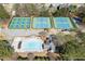 Aerial shot showing tennis courts, pool, and other community ammenities in wooded area at 1673 Chadwick Ridge Dr, Lawrenceville, GA 30043