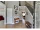 Inviting foyer with hardwood floors, a staircase with iron balusters, and natural light streaming in at 1673 Chadwick Ridge Dr, Lawrenceville, GA 30043
