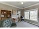 Bright home office featuring natural light, neutral colors, a ceiling fan, and ample space for furniture at 1673 Chadwick Ridge Dr, Lawrenceville, GA 30043
