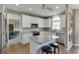 Bright kitchen with white cabinets, stainless steel appliances, and a granite-topped island with stool seating at 1673 Chadwick Ridge Dr, Lawrenceville, GA 30043