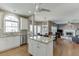 Bright kitchen with granite countertops, stainless appliances and a breakfast bar flowing into an open living area at 1673 Chadwick Ridge Dr, Lawrenceville, GA 30043