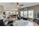 Open living space flows to the kitchen, featuring hardwood floors and lots of natural light at 1673 Chadwick Ridge Dr, Lawrenceville, GA 30043