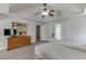 This main bedroom features neutral walls, plush carpet, a ceiling fan, and plenty of space for comfort and style at 1673 Chadwick Ridge Dr, Lawrenceville, GA 30043