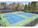 Community tennis courts with well-maintained blue courts and Chadwick signage at 1673 Chadwick Ridge Dr, Lawrenceville, GA 30043
