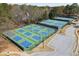 Aerial view of community tennis and pickleball courts, and a parking area at 1673 Chadwick Ridge Dr, Lawrenceville, GA 30043