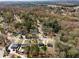 Neighborhood aerial view showcasing mature trees, well-kept lawns, and proximity to nature at 6370 Boca Grande Blvd, Forest Park, GA 30297