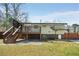 Back of house features a wood deck, stairs, and a covered patio area with shade at 6370 Boca Grande Blvd, Forest Park, GA 30297