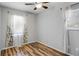 Bedroom features wood-look floors, white walls, and two bright windows at 6370 Boca Grande Blvd, Forest Park, GA 30297