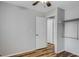 Bedroom with wood-look floors, closet, two doors, and neutral wall paint at 6370 Boca Grande Blvd, Forest Park, GA 30297