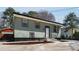 Charming house with a tidy lawn and a long driveway at 6370 Boca Grande Blvd, Forest Park, GA 30297