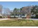 Quaint one-story home featuring a spacious lawn and modern appeal at 6370 Boca Grande Blvd, Forest Park, GA 30297