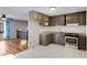 Updated kitchen with stainless steel appliances, granite counters, and hardwood floors to a bright living space at 6370 Boca Grande Blvd, Forest Park, GA 30297