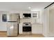 Modern kitchen with stainless steel appliances, quartz countertops, and bright, neutral design at 6370 Boca Grande Blvd, Forest Park, GA 30297