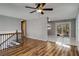 Upper-level living space with hardwood floors and sliding glass doors at 6370 Boca Grande Blvd, Forest Park, GA 30297