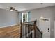 Light-filled living room with hardwood floors and a staircase at 6370 Boca Grande Blvd, Forest Park, GA 30297