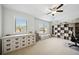 Spacious room offering lots of display shelving with desk and natural light at 6825 Concord Brook Ln, Cumming, GA 30028