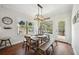 Charming dining area with a wooden table, bench seating, and natural light, ideal for Gathering meals and gatherings at 6825 Concord Brook Ln, Cumming, GA 30028