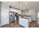 Modern kitchen featuring stainless steel appliances, white cabinets, granite countertops, and a center island at 1561 Cooks Pond Dr, Powder Springs, GA 30127