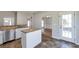 Kitchen island with granite countertops, tile backsplash, stainless steel dishwasher, and eat-in kitchen at 1561 Cooks Pond Dr, Powder Springs, GA 30127