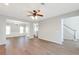Spacious living area with hardwood floors, ceiling fan, and an open layout for entertaining at 1561 Cooks Pond Dr, Powder Springs, GA 30127