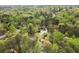 An extensive tree canopy enshrouds the homes below in this expansive aerial view at 2115 Hawthorne Pt, Marietta, GA 30062