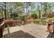 Large wooden back deck surrounded by lush greenery and trees, with railing at 2115 Hawthorne Pt, Marietta, GA 30062