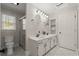 Bright bathroom with double sinks, granite counters, and a glass enclosed shower at 2115 Hawthorne Pt, Marietta, GA 30062