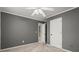 This bedroom features neutral walls, white trim, ceiling fan and plush carpeting at 2115 Hawthorne Pt, Marietta, GA 30062