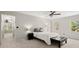 Spacious bedroom with natural light, neutral walls, soft carpet and a ceiling fan at 2115 Hawthorne Pt, Marietta, GA 30062