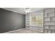 Bedroom with custom built-in shelving and a large window providing natural light at 2115 Hawthorne Pt, Marietta, GA 30062