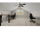 Bonus room with vaulted ceilings, plush carpeting, and windows for natural light at 2115 Hawthorne Pt, Marietta, GA 30062