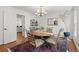 Charming dining room with hardwood floors and a chandelier, perfect for hosting dinner parties and Gathering meals at 2115 Hawthorne Pt, Marietta, GA 30062